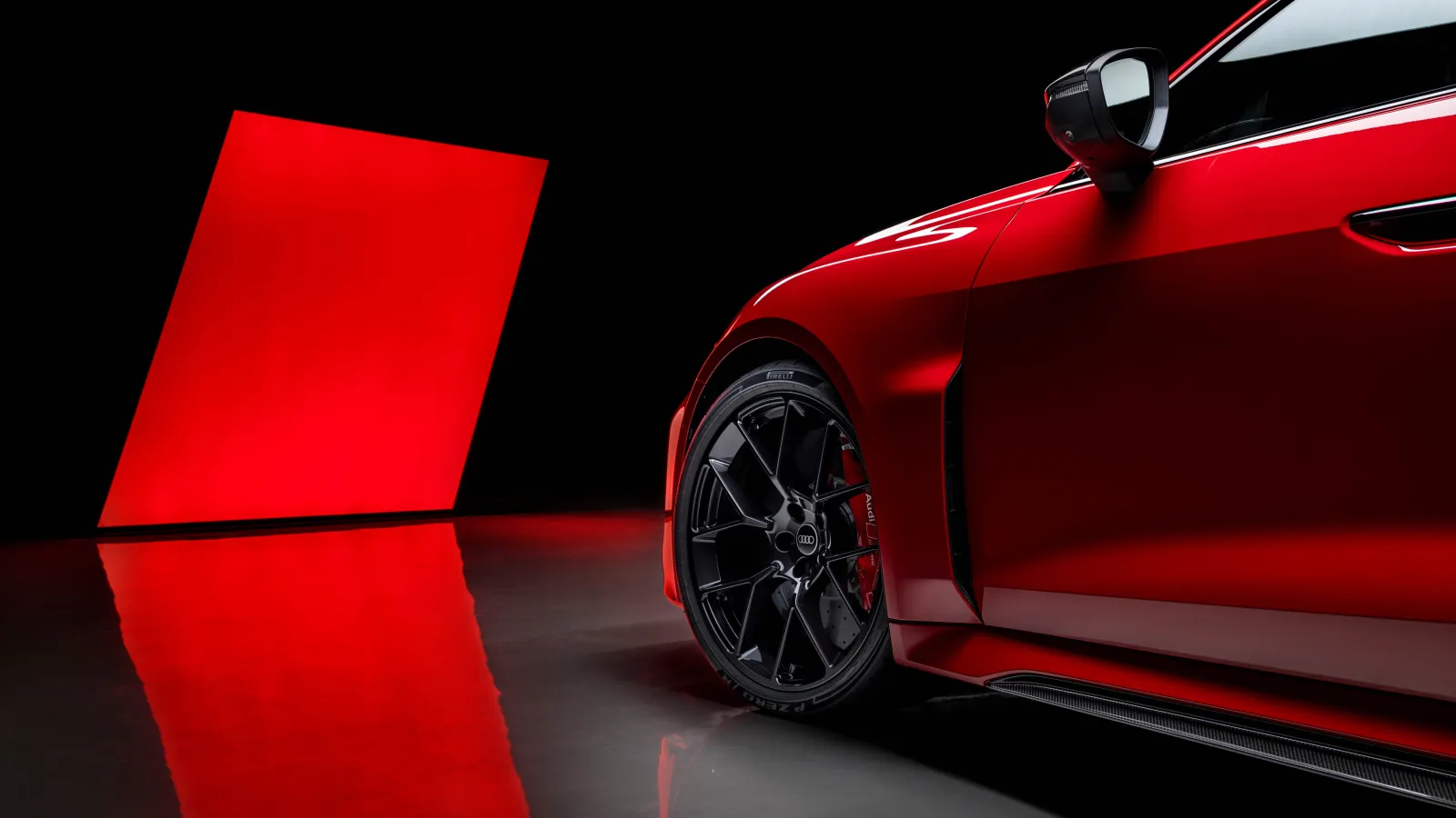 The Audi RS 5 Avant plug-in hybrid in Misano Red, highlighting the reinforced High Load (HL) Pirelli P Zero R tyre and black RS performance alloy wheels. Photo Credit: Pirelli